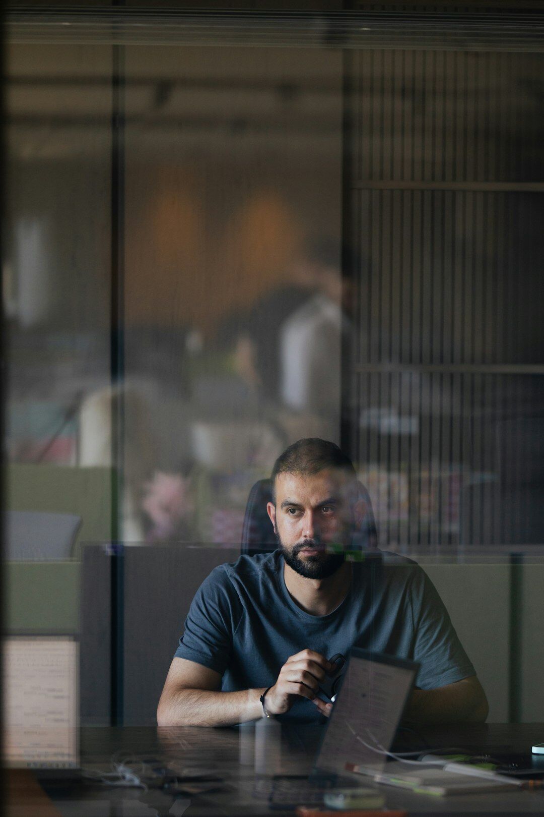 Man reading legal documents at a desk